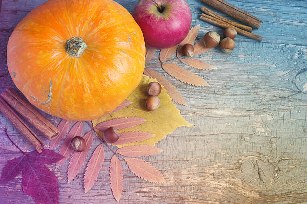 istock Vintage background with pumpkin, nuts and leaves. 590151836