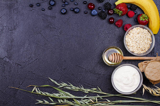 istock Yogurt, Oat Flakes, Fresh Apples, Honey and Summer Berries 590151942