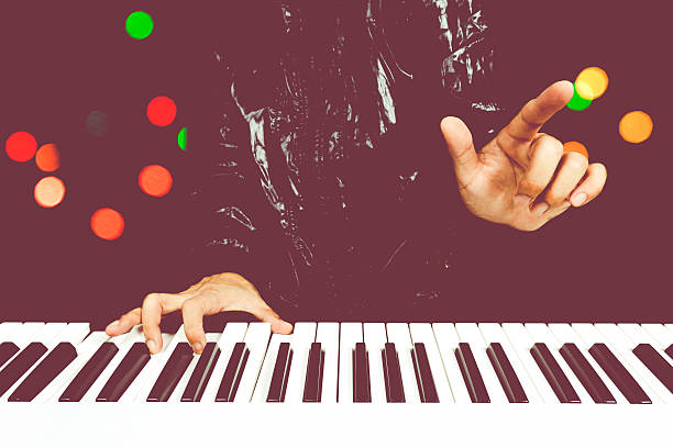 istock professional composer playing white piano with colourful bokeh background 590152804