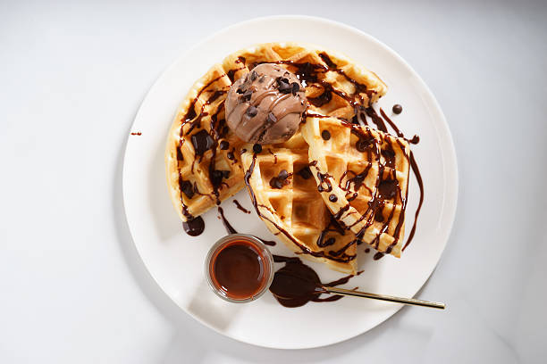 istock waffles with chocolate ice cream and chocolate sauce 590152840