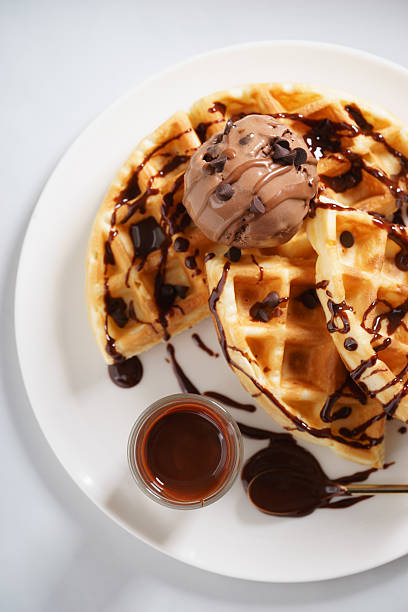istock waffles with chocolate ice cream and chocolate sauce 590152930