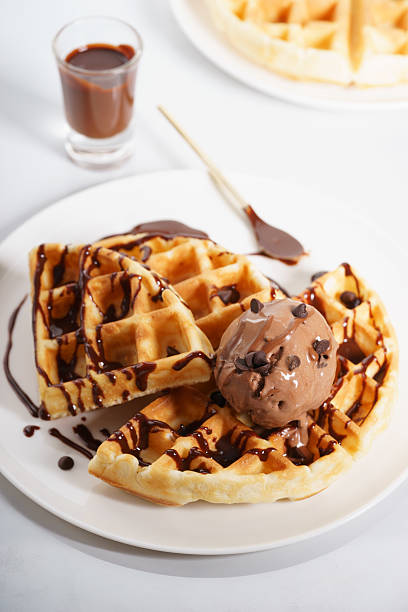 istock waffles with chocolate ice cream and chocolate sauce 590152994