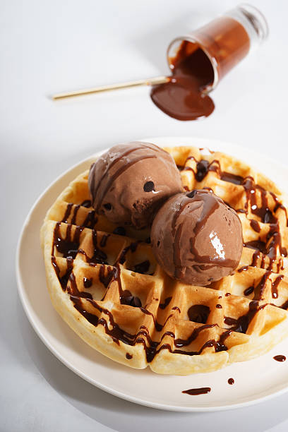 istock waffles with chocolate ice cream and chocolate sauce 590153070
