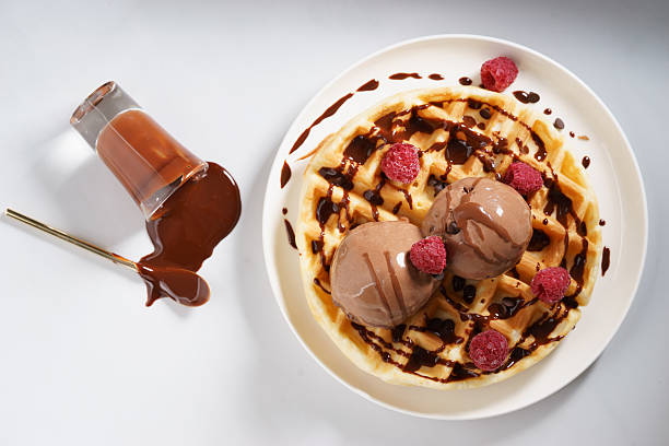 istock waffles with melt chocolate ice cream and chocolate sauce 590153540