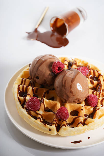 istock waffles with melt chocolate ice cream and chocolate sauce 590153612