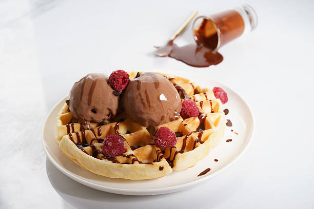 istock waffles with melt chocolate ice cream and chocolate sauce 590153676