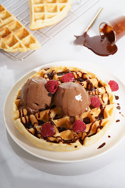 istock waffles with melt chocolate ice cream and chocolate sauce 590153736