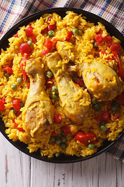 istock Spanish paella with chicken and vegetables closeup 590154020