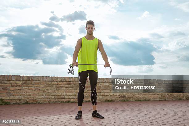 Young Man Fitness Resistance Band Training Stretching Stock Photo - Download Image Now