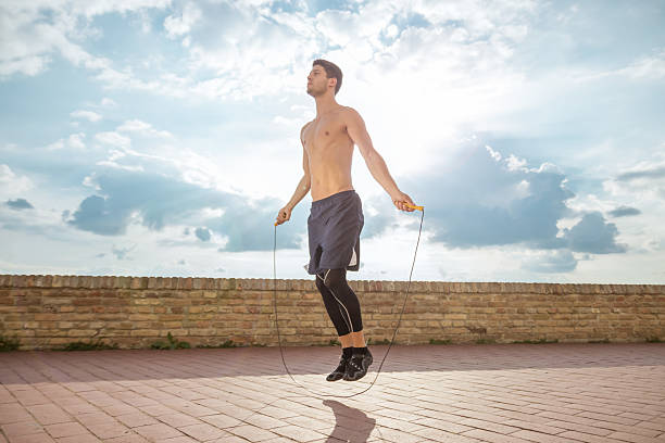 istock young man jump jumping rope fit slim abs model sunny 590155738