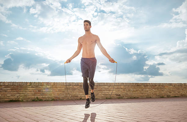 istock young man jump jumping rope fit slim abs model sunny 590155794