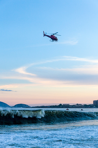 Helicopter flying over Copacabana Beach at sunset, Rio de Janeiro, Brazil