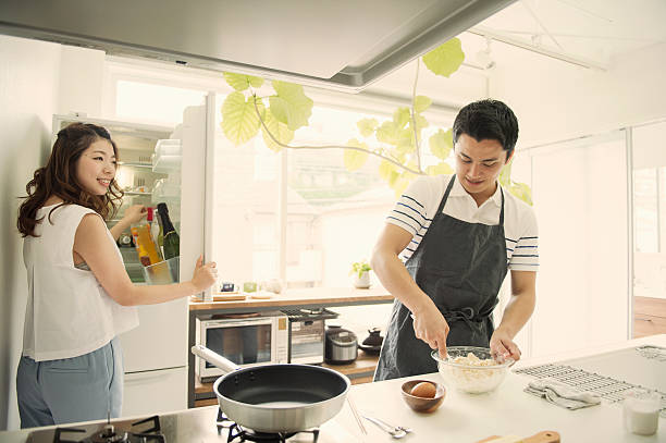 istock Japanese young couple cooking on holiday 590156842
