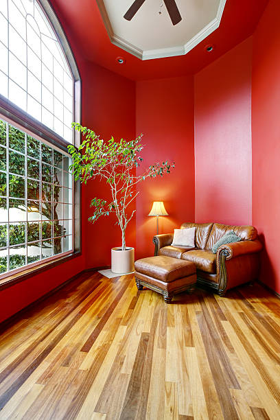 istock Rest area with red walls, big window and leather sofa 590156948