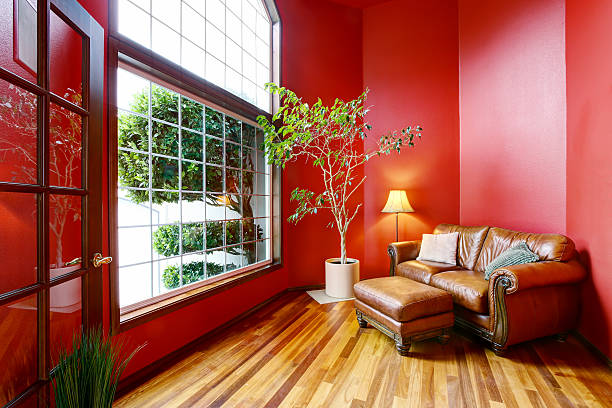 istock Rest area with red walls, big window and leather sofa 590156972