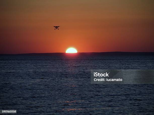 Drone At Sunset Stock Photo - Download Image Now - Airplane, Back Lit, Camera - Photographic Equipment