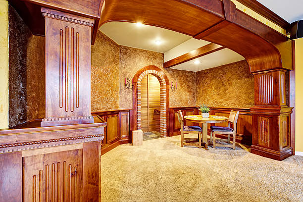 istock Luxury dining room interior with wooden trim and carpet floor. 590160464