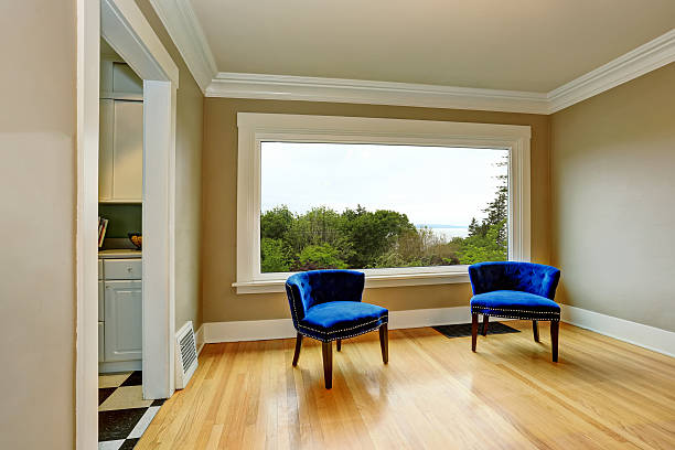 istock Empty living room interior with blue armchairs and hardwood floor 590162122