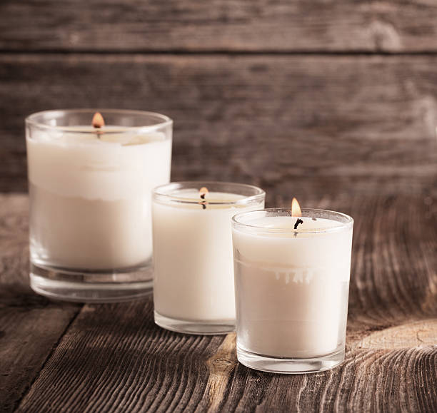 istock scented candles on old wooden background 590162876