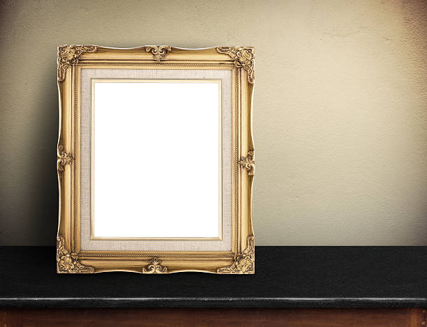 Blank Gold victorian picture frame on black marble table Blank Gold victorian picture frame on black marble table at yellow concrete wall,Template mock up for adding your design and leave space beside frame for adding more text leaning photos stock pictures, royalty-free photos & images