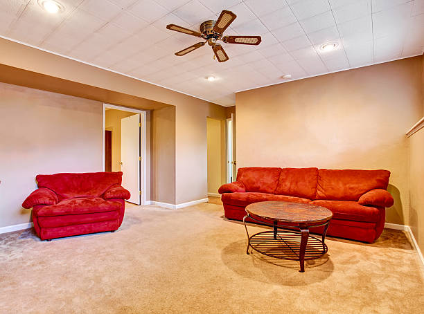 istock Empty living room interior with red sofa aand carpet floor. 590164710