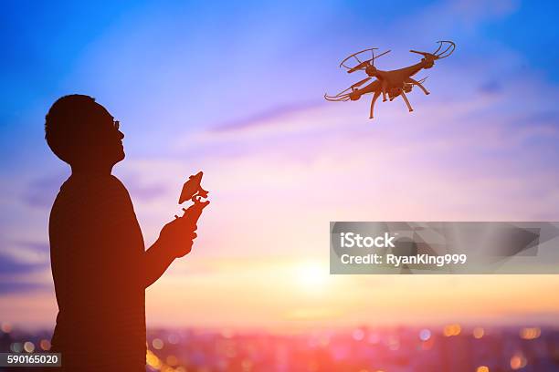 Silhouette Of Man Take Drone Stock Photo - Download Image Now - Drone, Flying, Drone Point of View