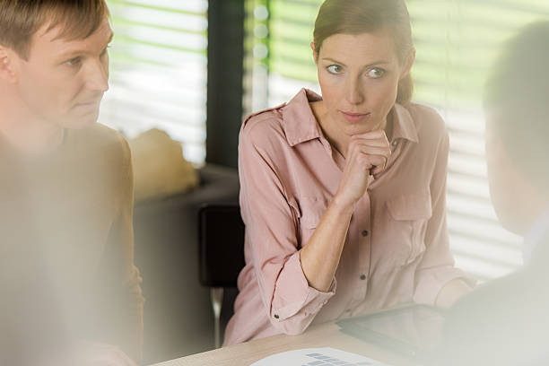 istock Couple listening to financial advisor 590165376