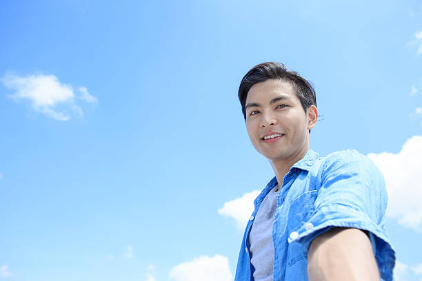 istock man smile happily selfie 590167004