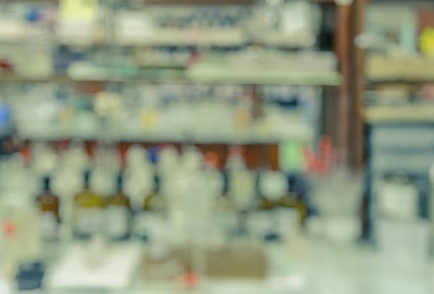 istock Blurred abstract background of workbench in chemistry laboratory 590167706