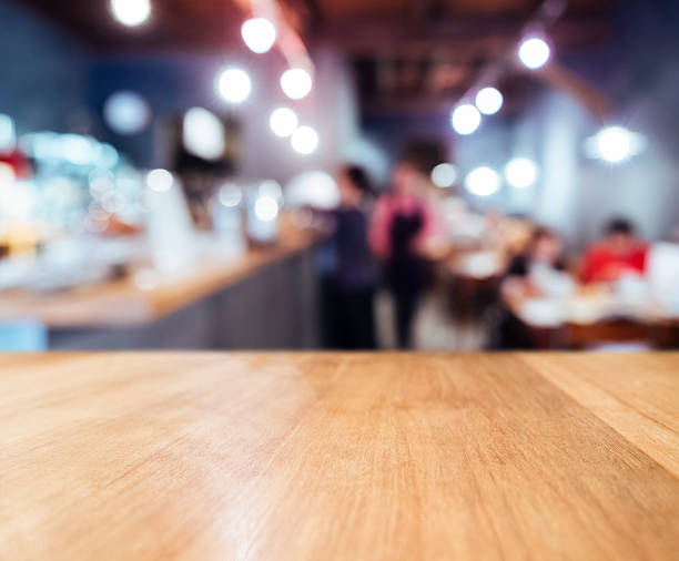 istock Table top counter Bar Restaurant background with people 590171038