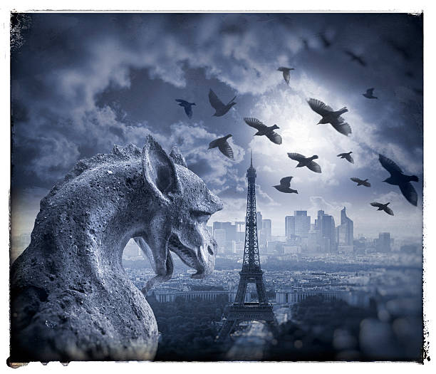 istock Gargoyle figur on Notre Dame with Eiffel Tower at night 590171712