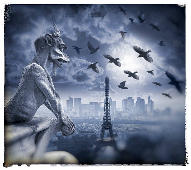 istock Gargoyle figur on Notre Dame with Eiffel Tower at night 590172352