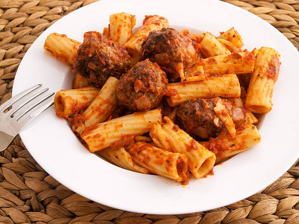 Penne with meatballs Itailian penne pasta with meatballs and tomatoes sauce. Horizontal shot penne meatballs stock pictures, royalty-free photos & images