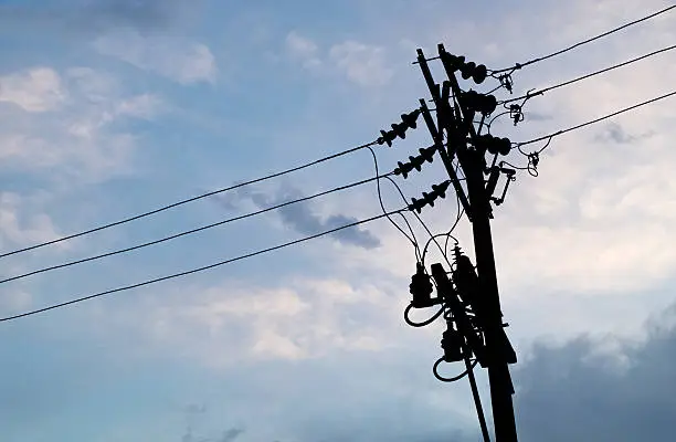 Photo of blue sky with cloud and silhouette electric pole