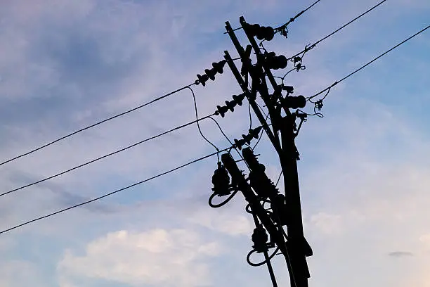 Photo of blue sky with cloud and silhouette electric pole