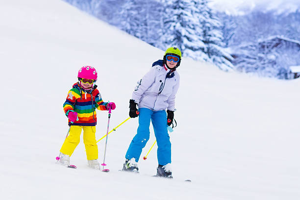 istock Kids skiing in the mountains 590172846