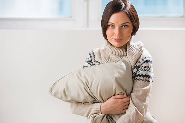 istock Attractive young woman daydreaming and missing her beloved 590173068