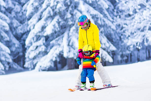 istock Mother and little boy learning to ski 590173288