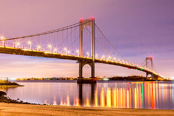 istock Bridge reflecting on the East River at night 590173608