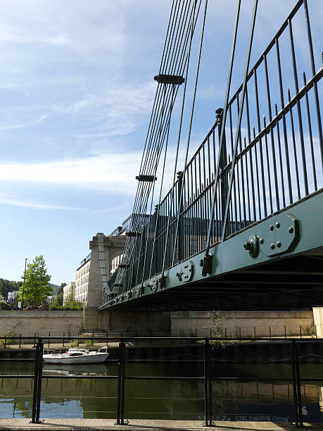 istock Suspension pedestrian bridge over canal in sunshine 2 590174172