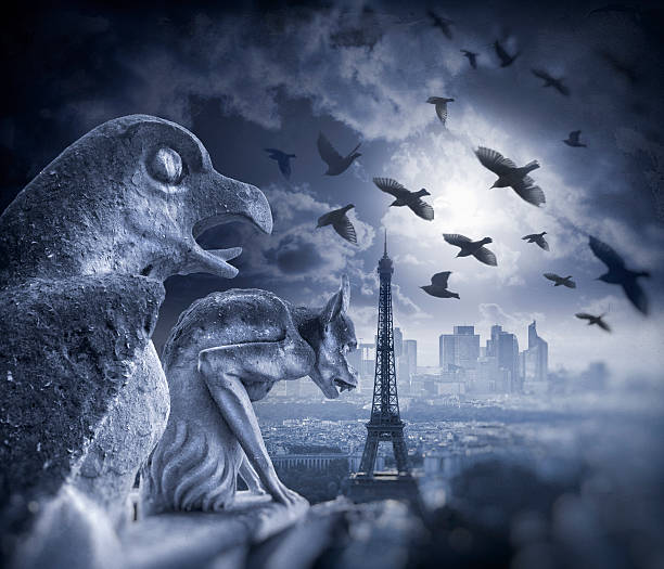 istock Gargoyle figur on Notre Dame with Eiffel Tower at night 590174706