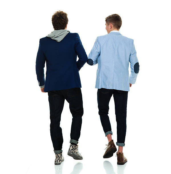 istock Rear view of brothers walking together 590174940