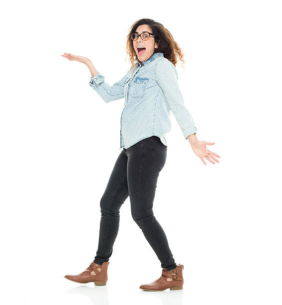 istock Woman looking shocked and presenting 590176672