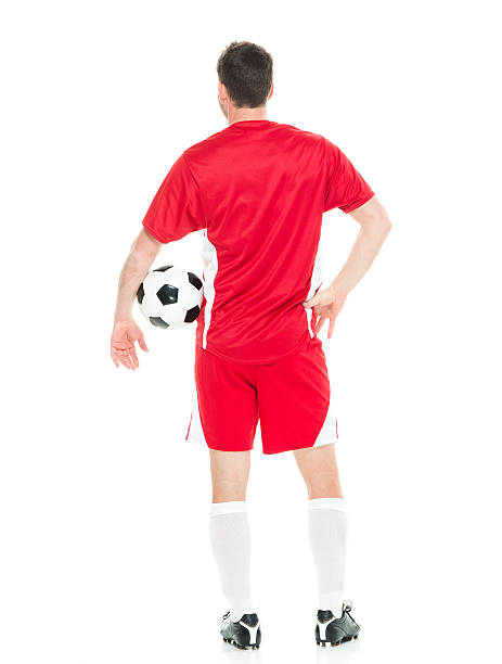istock Rear view of soccer player standing 590177334