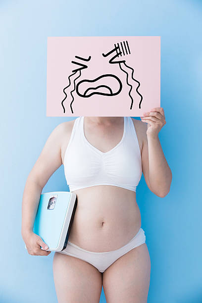 istock overweight woman take crying billboard 590178262