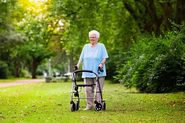 istock Senior handicapped lady with a walker 590240310