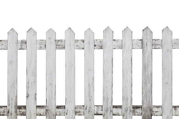 istock Old white wood fence isolated on white background 590240428