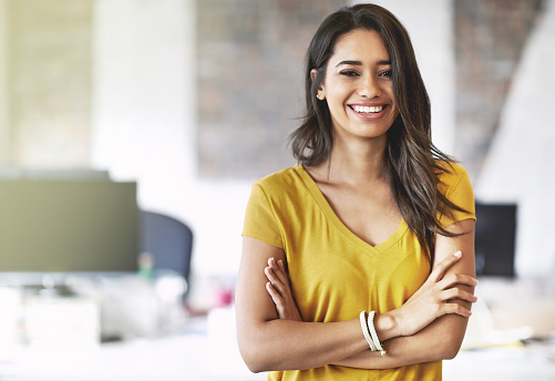 Cropped shot of an attractive young designer standing in her office