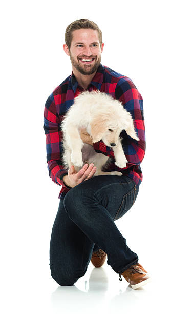 istock Cheerful man embracing dog 590243026