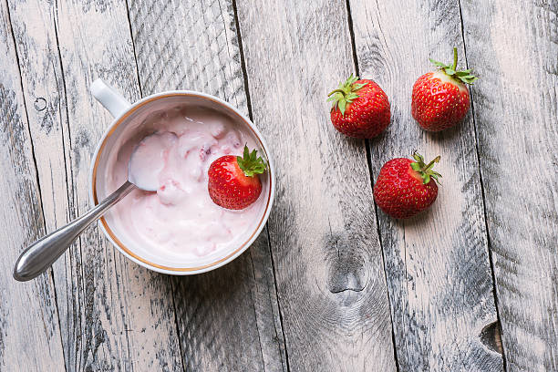 Strawberries and yogurt stock photo